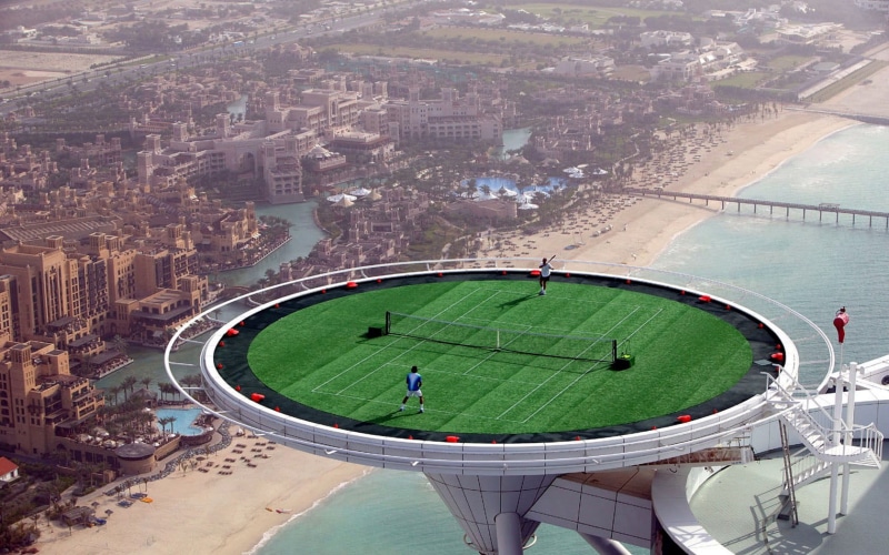 tennis, water, aerial, day, sport, stadium, 720P, city, built structure, building exterior, field, architecture, crowd, cityscape, view, Dubai, travel destinations