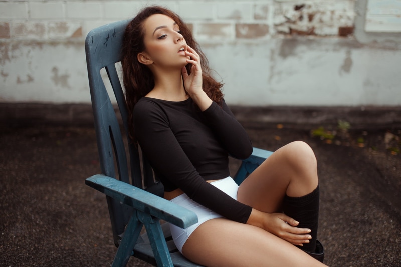 720P, chair, one person, portrait, hairstyle, real people, casual clothing, contemplation, women, finger on lips, young adult, beauty, black stockings