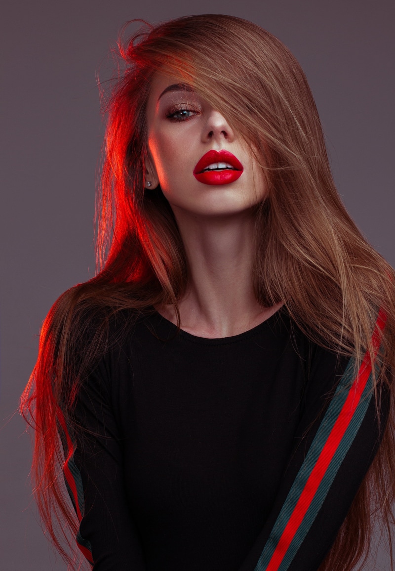 hair, model, red, 2K, adult, black background, beauty, dyed red hair, hair in face, sweatshirts, human lips, redhead, one person, beautiful woman, women