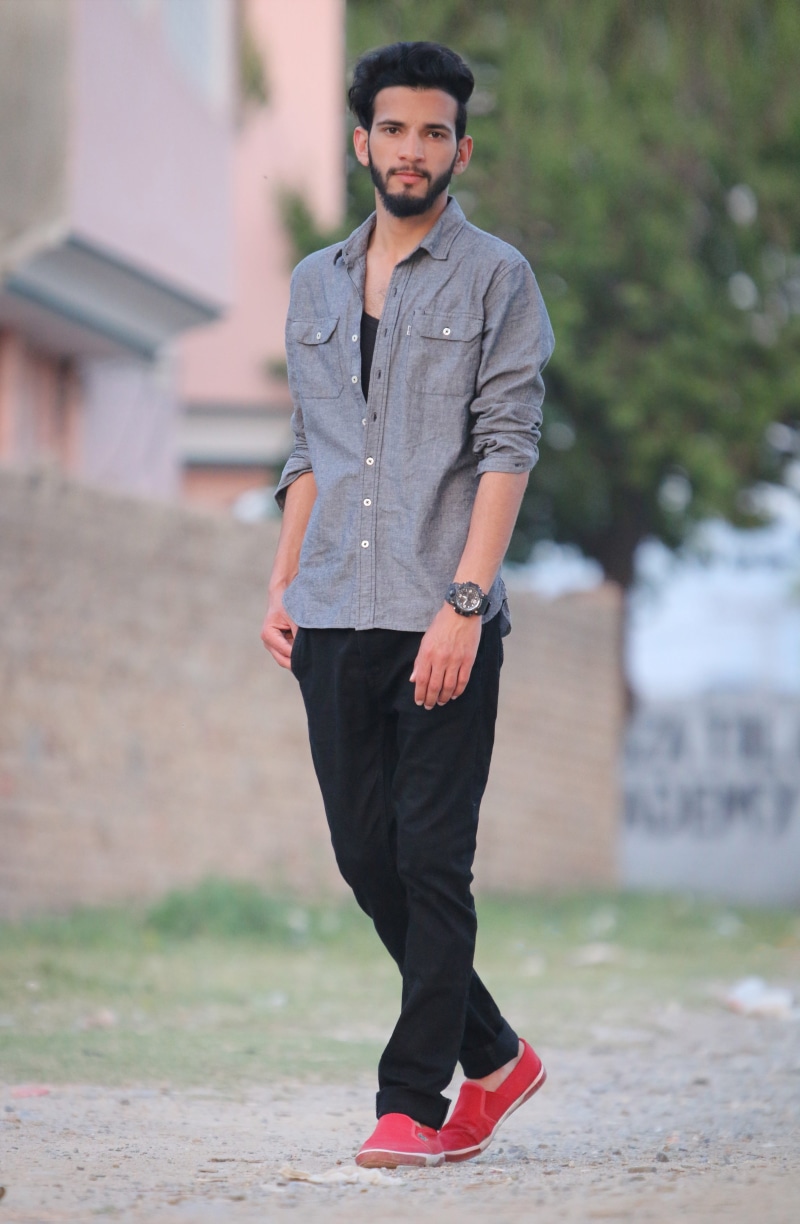 outdoors, blurry background, young, male model, glasses, pakistan, portrait, leisure activity, full length, casual clothing, 5K, asian boys, mans fashion
