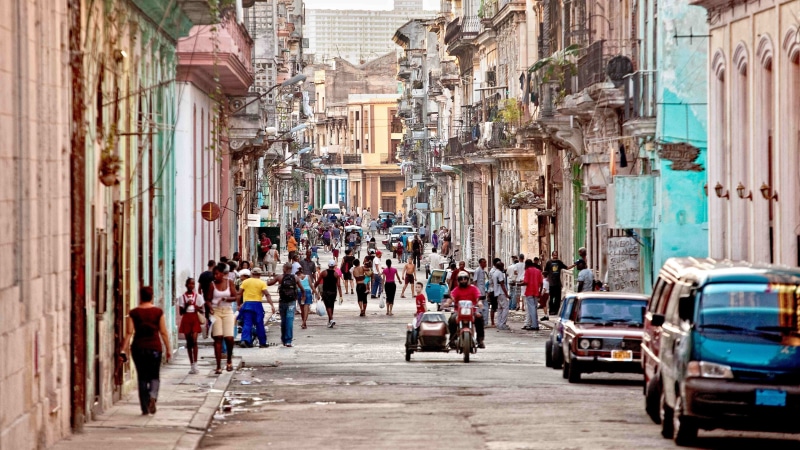 transportation, street, real people, building exterior, architecture, outdoors, building, Cuba, built structure, motor vehicle, town, women, group of people