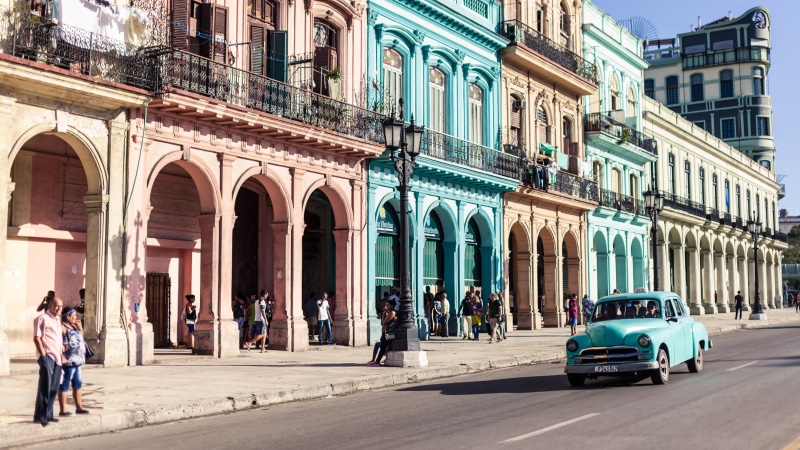 men, city, walking, arch, incidental people, real people, transportation, architecture, day, built structure, architectural column, building exterior, havana