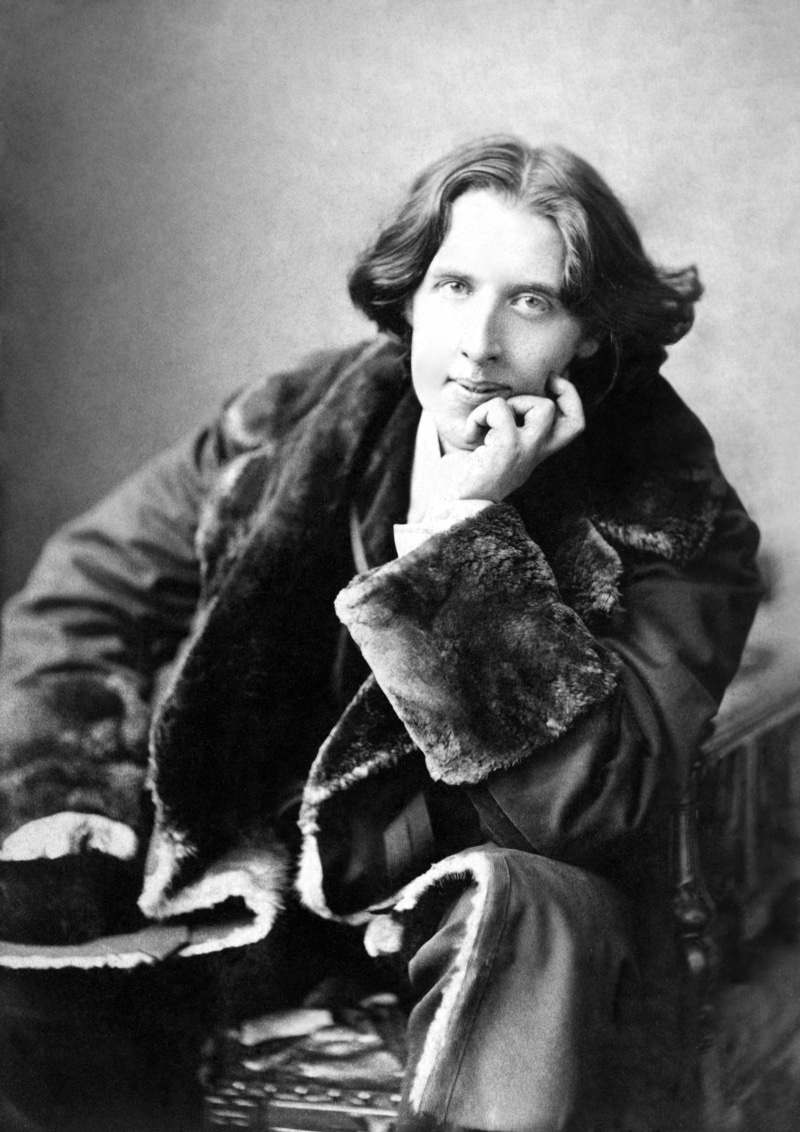 sitting, black, one person, men, facial hair, clothing, casual clothing, portrait, smoking - activity, fur coats, holding, cigarette, contemplation, monochrome