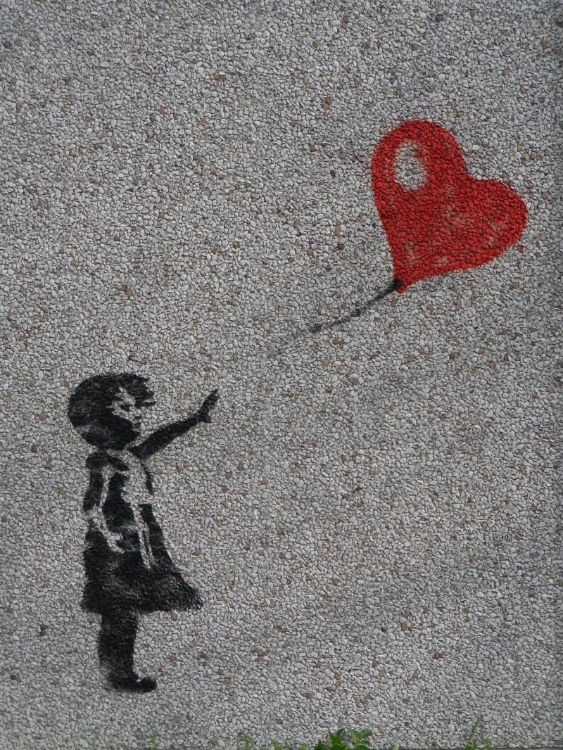 representation, cartoon, street, graffiti, reach, stand, longing, float, release, real people, apart, high angle view, banksy-motif, childhood, loss, transportation