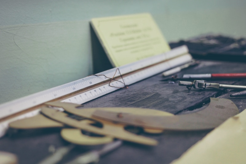 pencil, tools, desk, compass, still life, measuring, western script, book, high angle view, no people, message, communication, publication, work, indoors