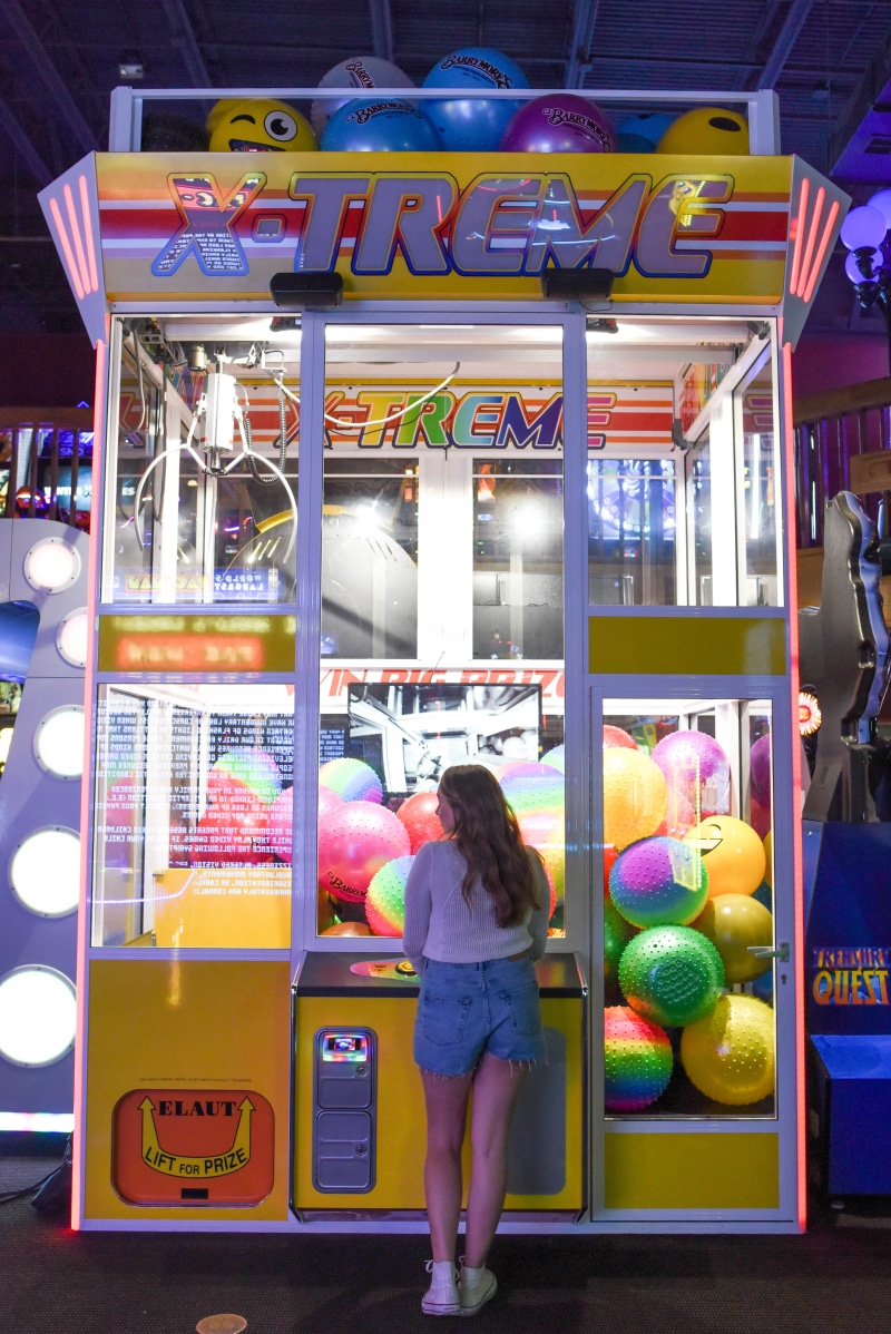 three quarter length, amusement park, play, women, arcade game, multi colored, lifestyles, 5K, shopping, front, gaming, neon, recreation, colourful, rear view