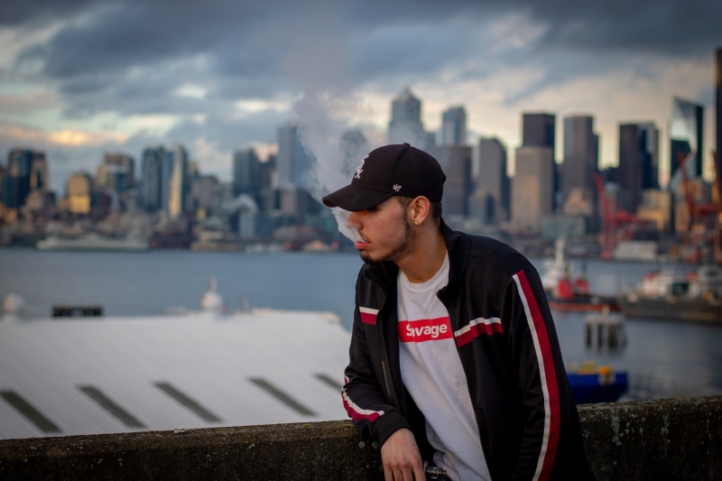 standing, casual clothing, young adult, leisure activity, sky, architecture, hat, one person, brandon, outdoors, pnw, vape, cityscape, looking, real people