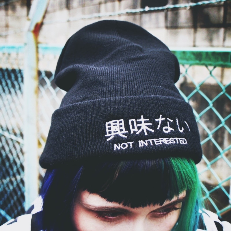 beanie, clothing, hiragana, 480P, day, communication, one person, real people, dyed hair, headshot, western script, hairstyle, hat, close-up, leisure activity