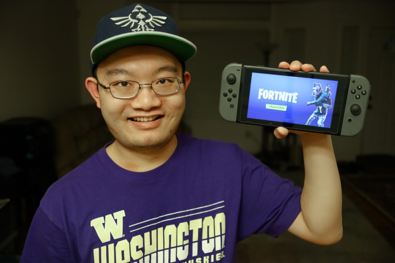 happiness, holding, young men, front view, nintendo, gamer, console, young adult, video game, cap, game, emotion, battle royale, fortnite, switch, male