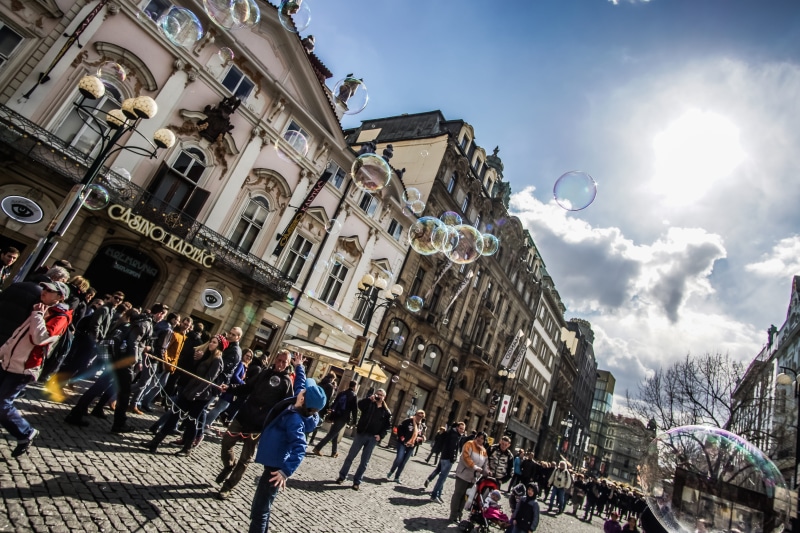 building, nature, adult, soapy, day, joy, sun, sky, transportation, building exterior, men, outdoors, bubbles, real people, large group of people, street