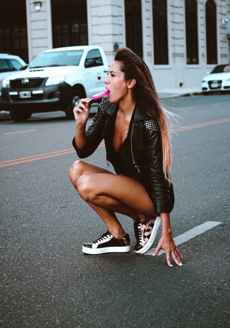 fashion, popsicle, full length, hairstyle, outdoors, sitting, girl, 2K, one person, car, ice pop, female, long hair, young women, lollipop, crouching