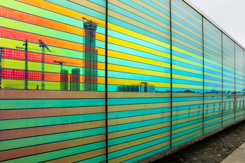 wall - building feature, built structure, window, glass - material, train, public transportation, rail transportation, day, city, modern, pop, building exterior