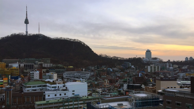 crowded, seoul, spire, architecture, tall - high, south korea, outdoors, built structure, myung dong, settlement, building exterior, travel destinations