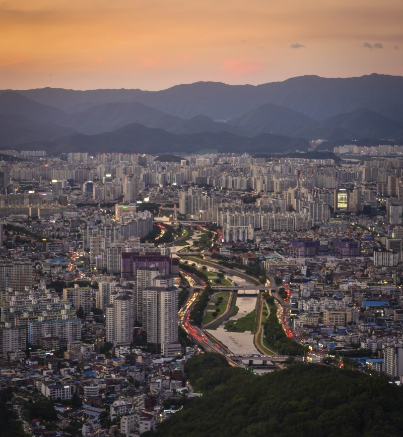 cityscape, residential district, high angle view, townscape, street, sunset, sky, transportation, city, red, river, aerial view, architecture, outdoors