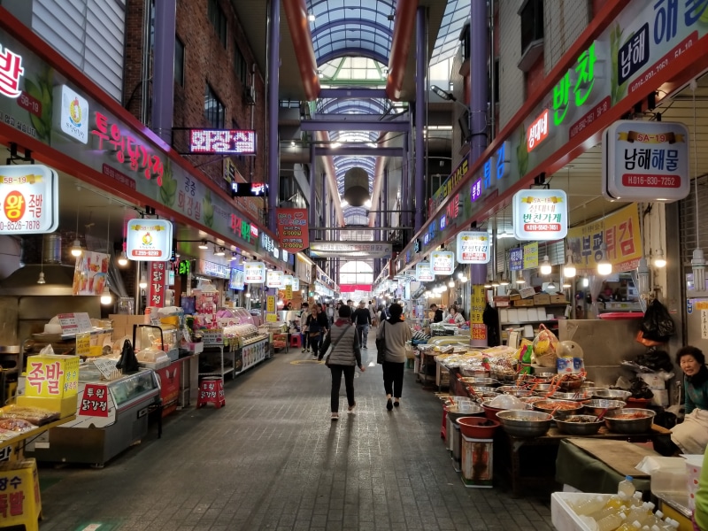 illuminated, south korea, text, men, architecture, retail, built structure, women, city, lifestyles, group of people, adult, non-western script, people