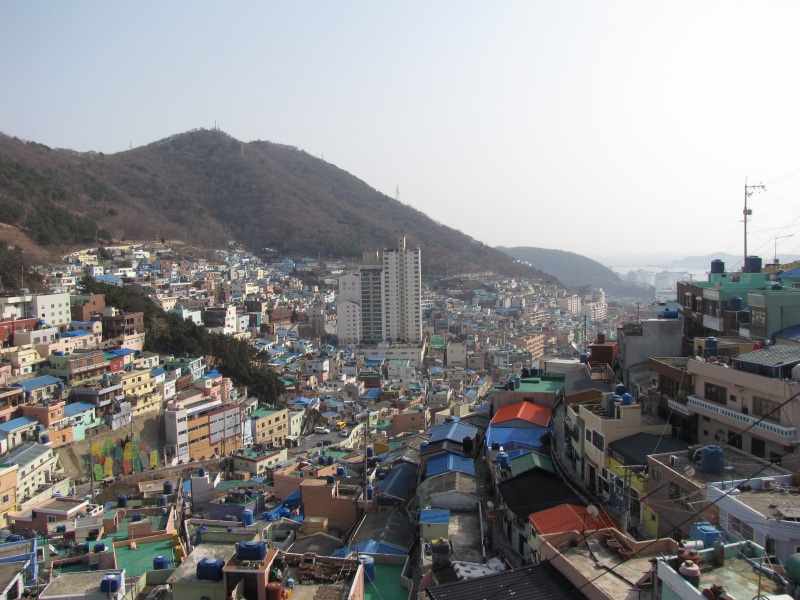 building exterior, townscape, residential district, high angle view, city life, landscape, crowd, crowded, home, architecture, sunlight, cultural village
