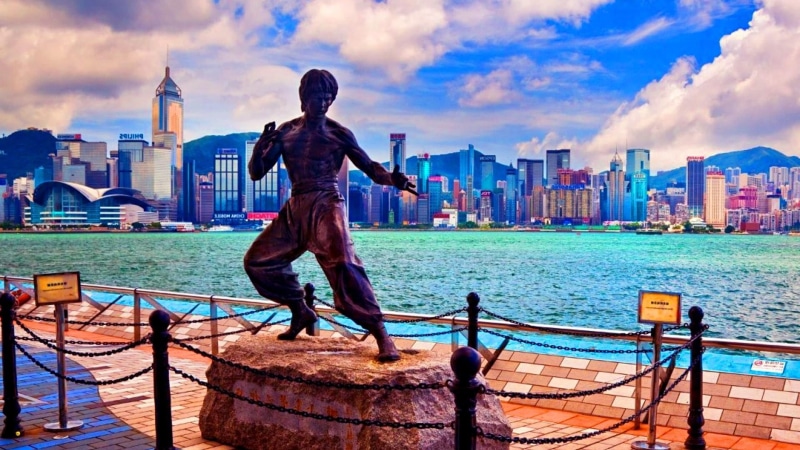 urban skyline, city, statue, nature, landscape, skyscraper, avenue of stars, cloud - sky, bruce lee, sea, railing, building, one person, office building exterior