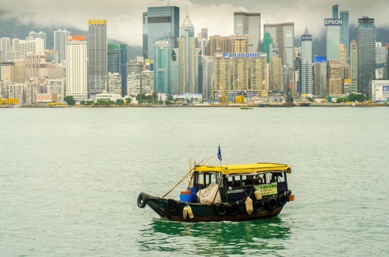 water, mode of transportation, sea, architecture, Hong Kong, transportation, real people, nature, financial district, waterfront, black, building, city