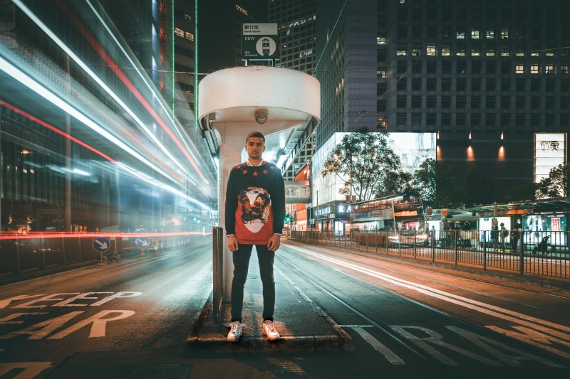 track, man, young adult, city, af1, standing, print, night photography, time, night life, stands, front view, island, mode of transportation, printed shirt