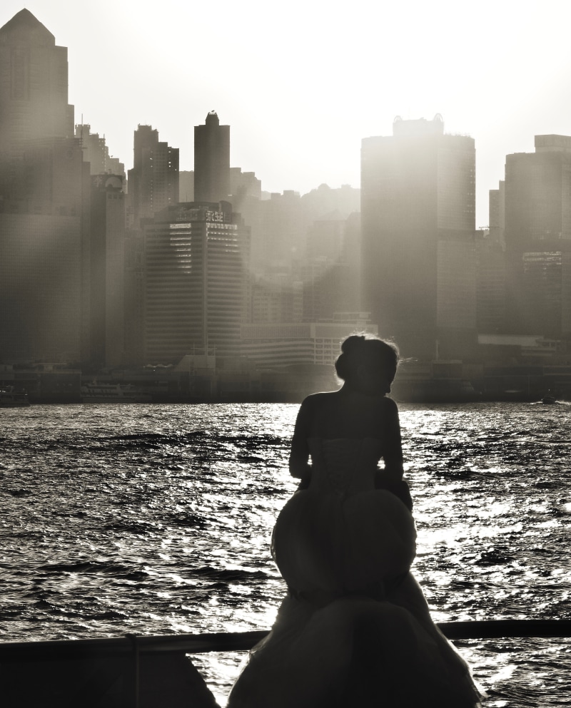 lens flare, lifestyles, one person, water, outdoors, built structure, 4K, building exterior, men, building, architecture, day, kowloon public pier, sitting