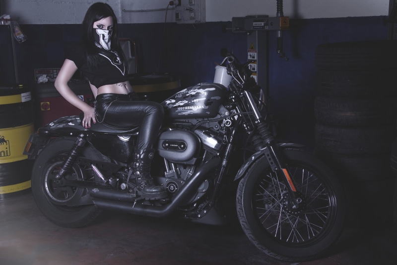 Harley-Davidson, speed, bicycle, indoors, wheel, real people, hairstyle, beautiful woman, mode of Transport, driving, transportation, black Color, motorcycle