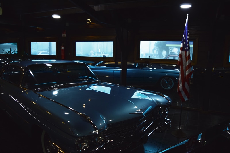 mode of transportation, lighting equipment, auto, metallic, vehicle interior, old car, wheels, vintage car, garage, style, transportation system, flag