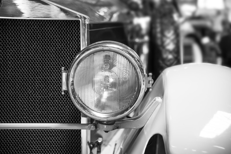 land Vehicle, shiny, city, close-up, automotive, black and white, antique, headlight, chrome, no people, old-fashioned, transportation, section, electric lamp