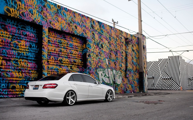 creativity, city, car, mode of transportation, outdoors, graffiti, motor vehicle, mural, sedan, land vehicle, art and craft, Mercedes-Benz, wall, garage