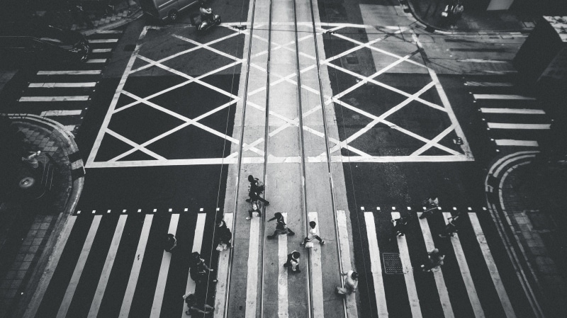 day, road, car, land vehicle, esthetic label, sign, architecture, mode of transportation, black and white, city, symbol, crossing, walking, people, road marking