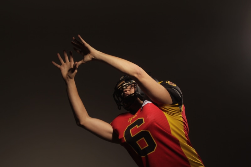 black background, american football, ball, the, motion, sport, deb, arms raised, competition, studio shot, strong, human limb, football, boots, futball