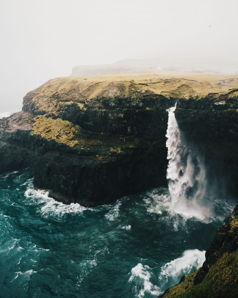 rock, cliff, surfing, power in nature, cliff side, power, nature, outdoors, flowing, blue, daytime, scenics - nature, water, brown, waterfall, beauty in nature