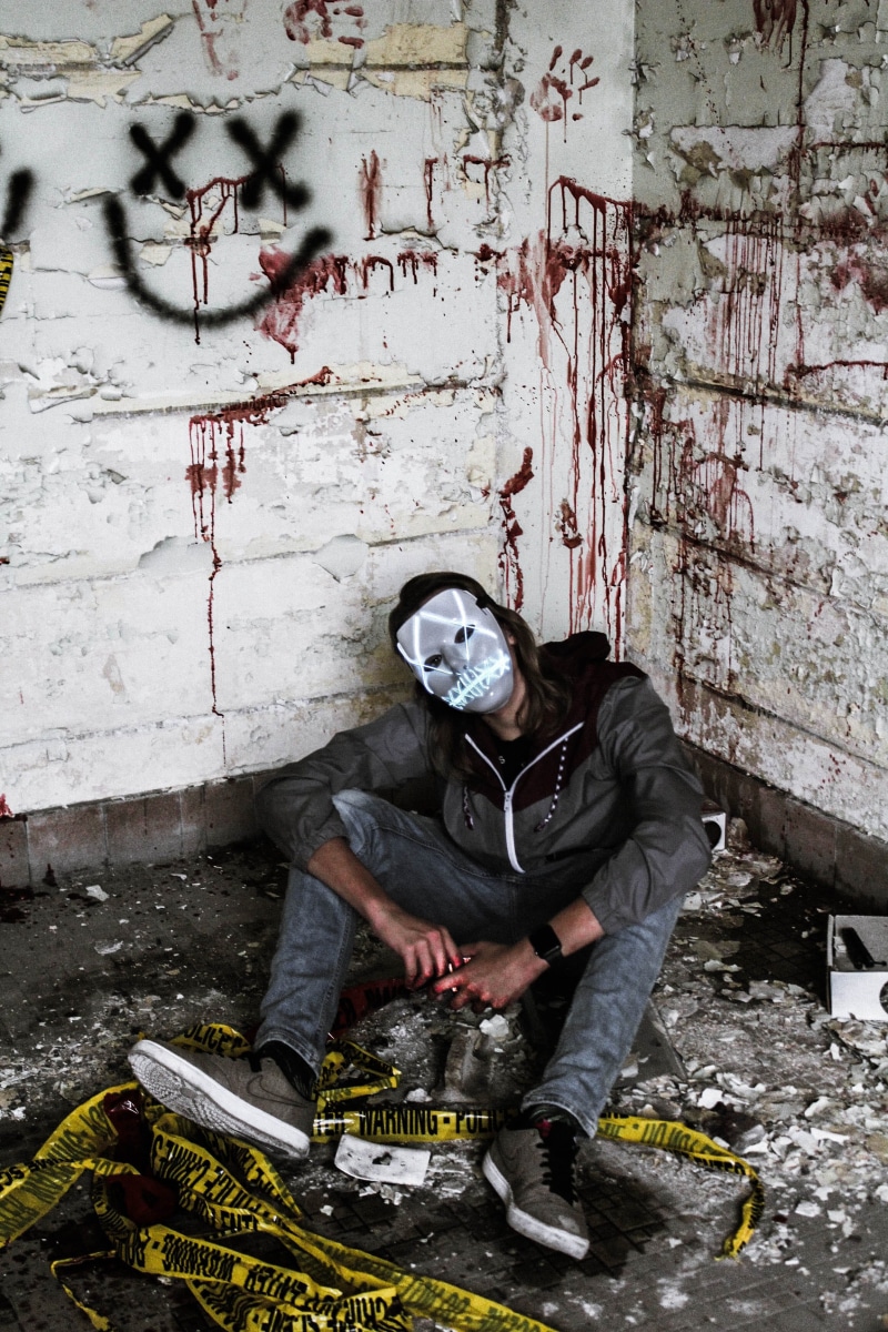 portrait, architecture, brick, front view, young adult, bloody, creepy, dirty, scary, social issues, graffiti, deterioration, lifestyles, horror, purge