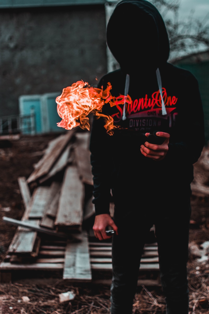 self portraut, portrait, hoodie, fire - natural phenomenon, flame, obscured face, fire, black, communication, self portrait, urbex, lifestyles, text, pants