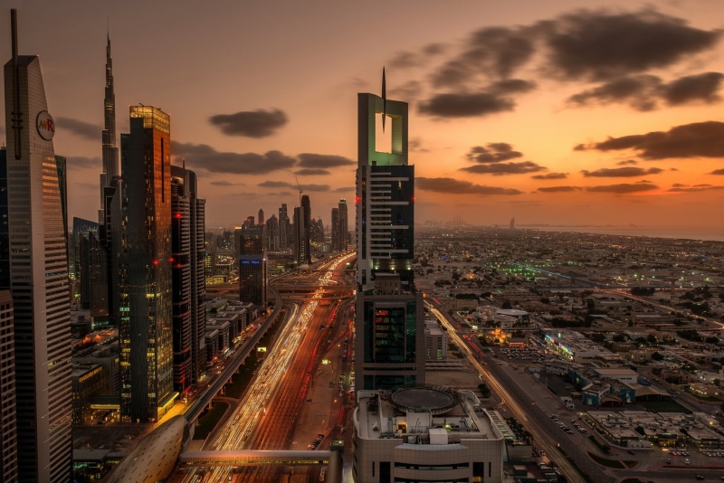 skycrapers, high angle view, skyscraper, building exterior, illuminated, traffic, multiple lane highway, crowded, Dubai, office building exterior, financial district