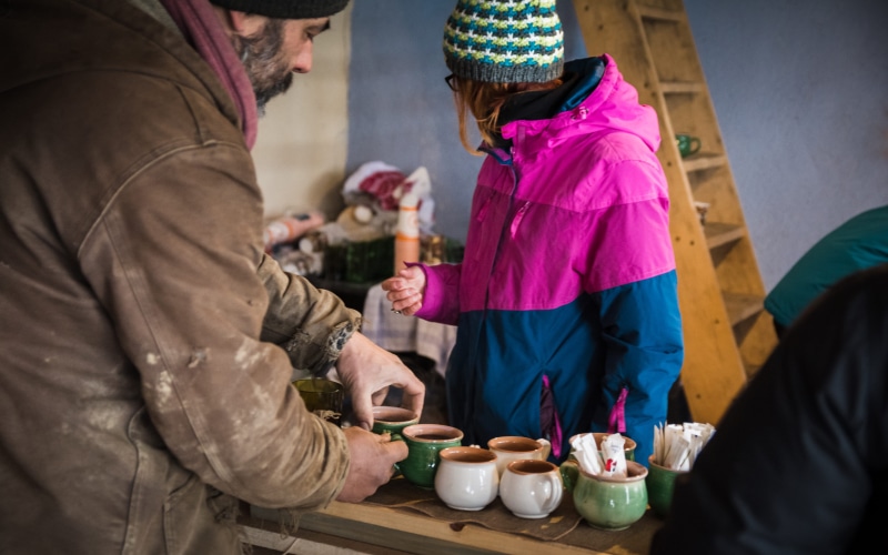 wine, holding, women, beard, hot drink, 5K, tea, adult, winter hat, coffee cup, magentum, cold weather, men, food and drink, cold, sitting, pink, people