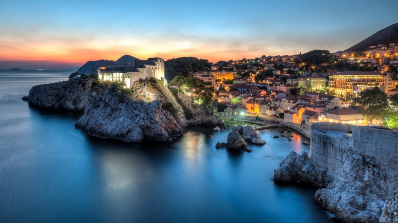 sea, scenics - nature, building exterior, sky, Dubrovnik, built structure, long exposure, beauty in nature, outdoors, illuminated, dusk, building, water