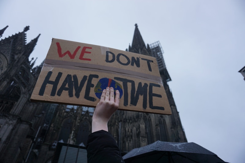 western script, holding, day, nature, sky, shield, protest action, cologne, body part, climate, fridays for future, human limb, show me, students, one person