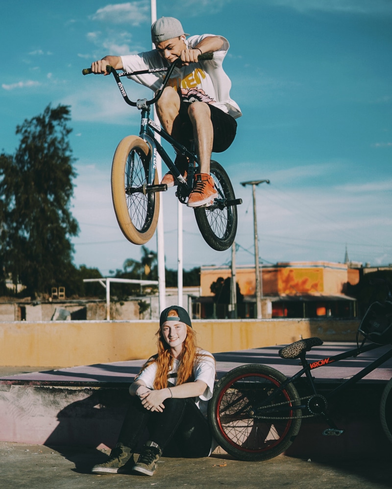 park, friend, skatepark, fun, people, outdoors, young adult, ginger, black, land vehicle, bmx, young women, nature, sunlight, teal and orange, casual clothing