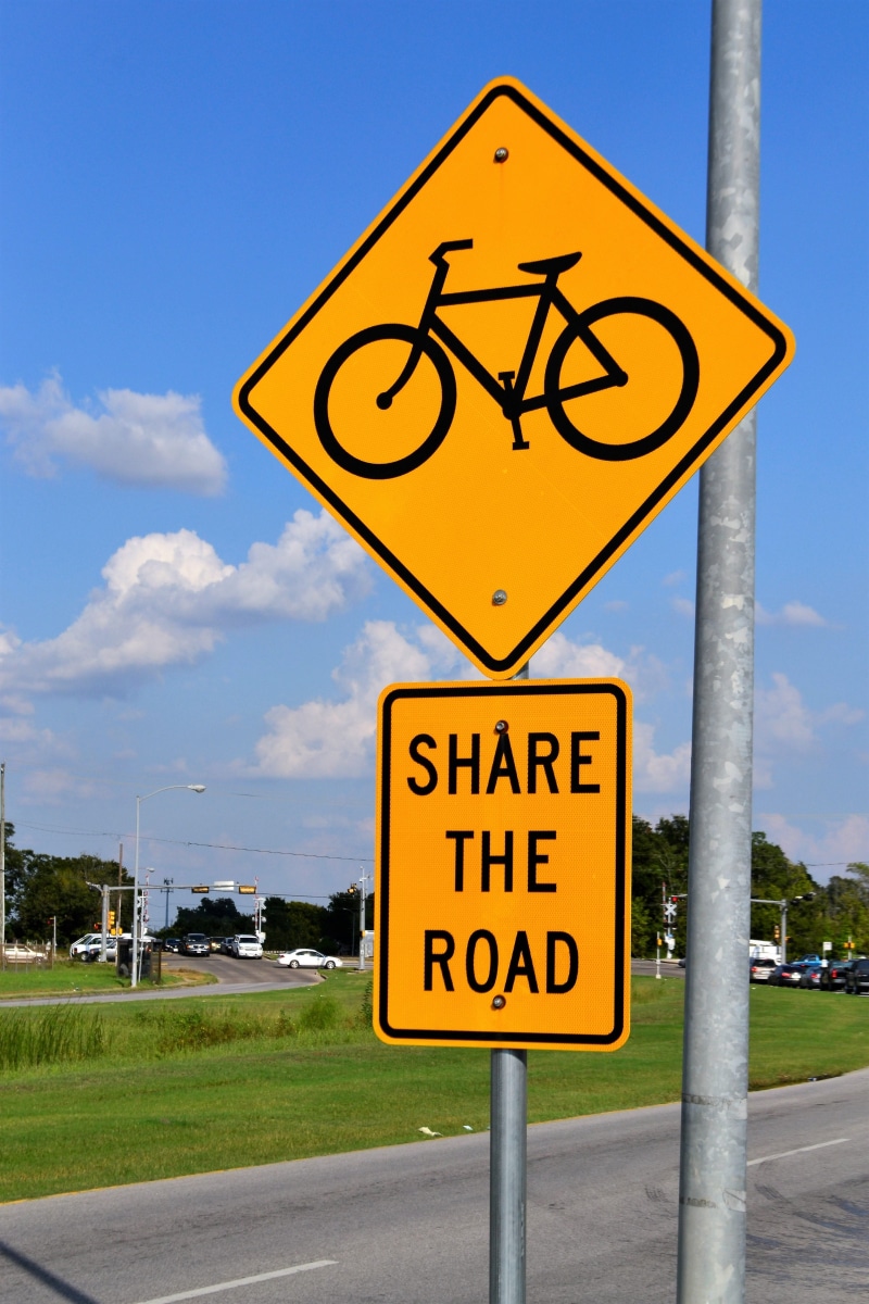 lifestyle, people, exercise, grass, shared, clouds, guidance, cloud - sky, share the road, active, transport, travel, green, street, urban, signage, bicyclist