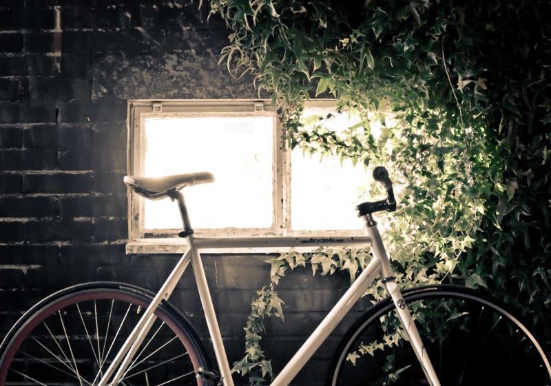 4K, transportation, ivy, black, land vehicle, sunlight, wall, light, gear, brick, wheel, beside, building exterior, fixed, stationary, no people, inside