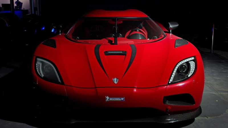 supercar, land vehicle, auto show, koenigsegg agera r, performance car, red, koenigsegg, night, wheel, automotive design, car, automotive lighting, incidental people