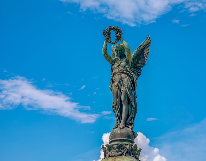low angle view, sky, collected, female likeness, outdoors, clouds, craft, 4K, laurel wreath, male likeness, sculpture, nature, creativity, day, bronze statue