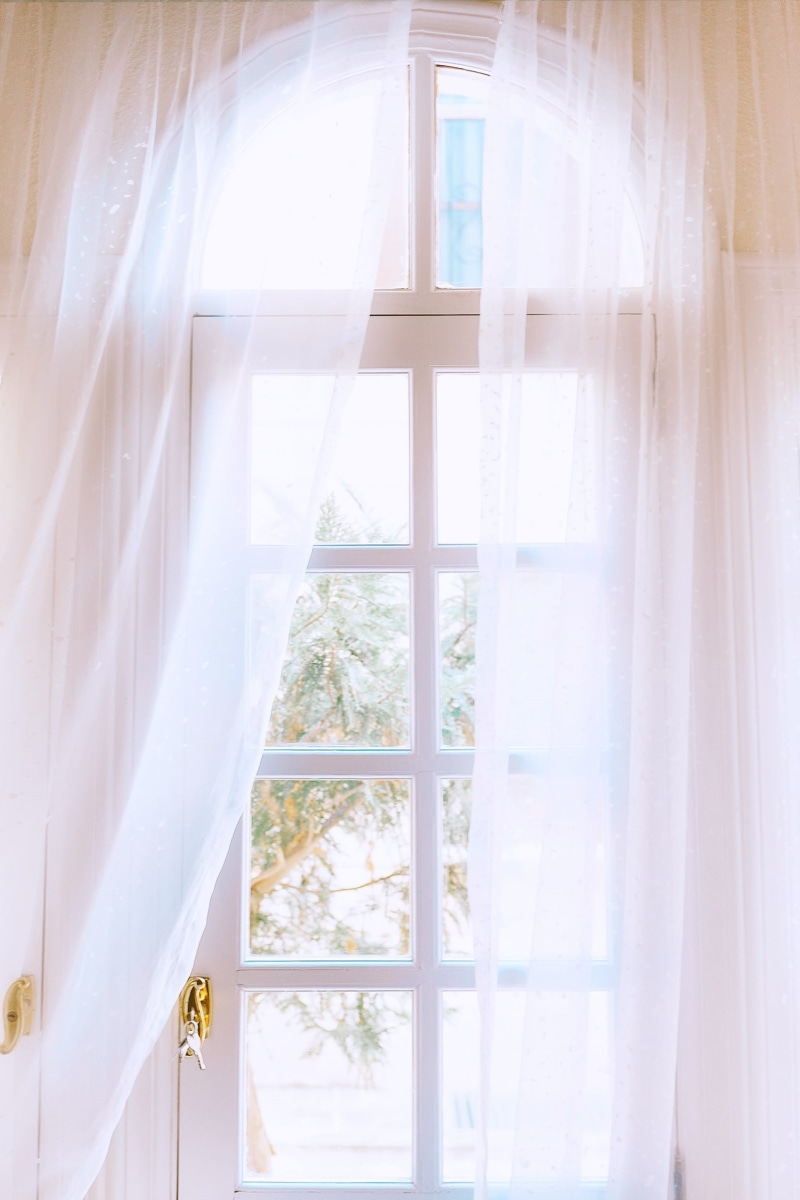 domestic room, hanging, outdoors, van, transportation, framed, indoors, white color, plant, day, table, crib, no people, transparent, brightly lit, white