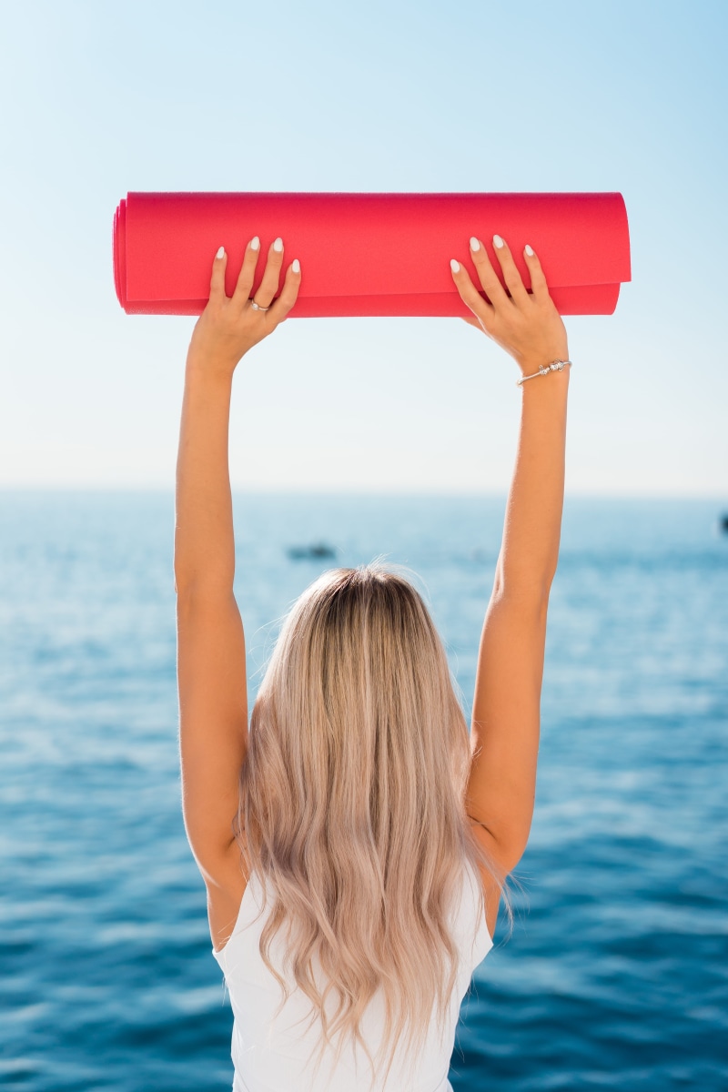 blonde, horizon over water, health, mat, ocean, woman, beach, young, fit girl, exercise, pilates, leisure activity, fitness, fit, yoga mat, real people