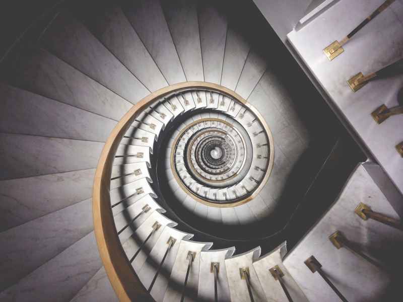 geometric shape, directly above, swirl, stairs, directly below, spiral stairs, absence, design, indoors, steps and staircases, high angle view, spiral