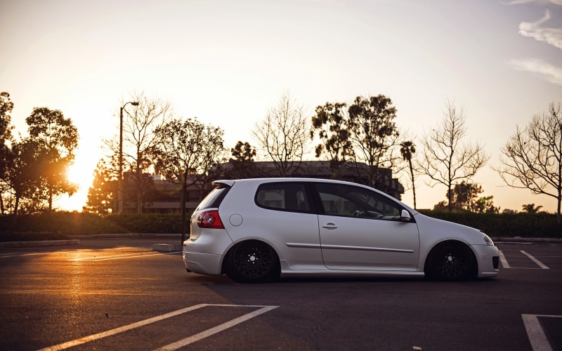 sunlight, stance, outdoors, GTI, MK5, motor vehicle, sunset, day, gray, tree, sky, nature, on the move, mode of transportation, motion, hatchback, city