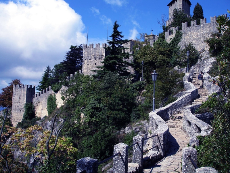 built structure, the past, architecture, tree, building, history, nature, cloud - sky, stairs, the middle ages, sky, wall, city, castle, plant, San Marino