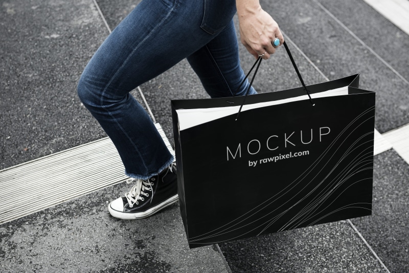 message, commercial, low section, communication, consumer, brand, city, commerce, day, style, real people, hand, casual clothing, paper bag, modern, wear