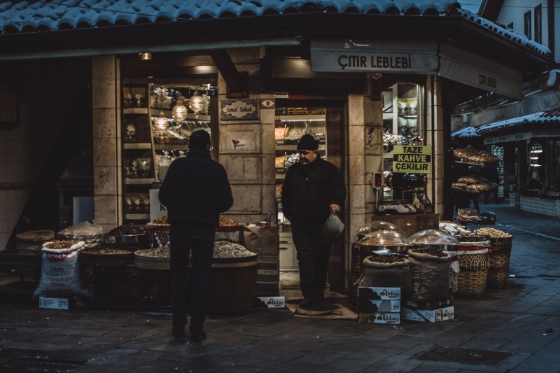 architecture, market, shelf, illuminated, real people, near, twomen, yellow, business, sweets, newsstand, man, lifestyles, 4K, city, front, building exterior