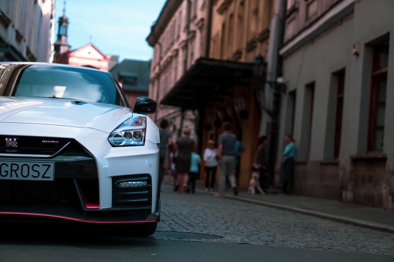 coupe, sports car, city life, kiosk, pottery, photography, 5K, urban, day, outdoors, building exterior, car, focus on foreground, sports, motor vehicle